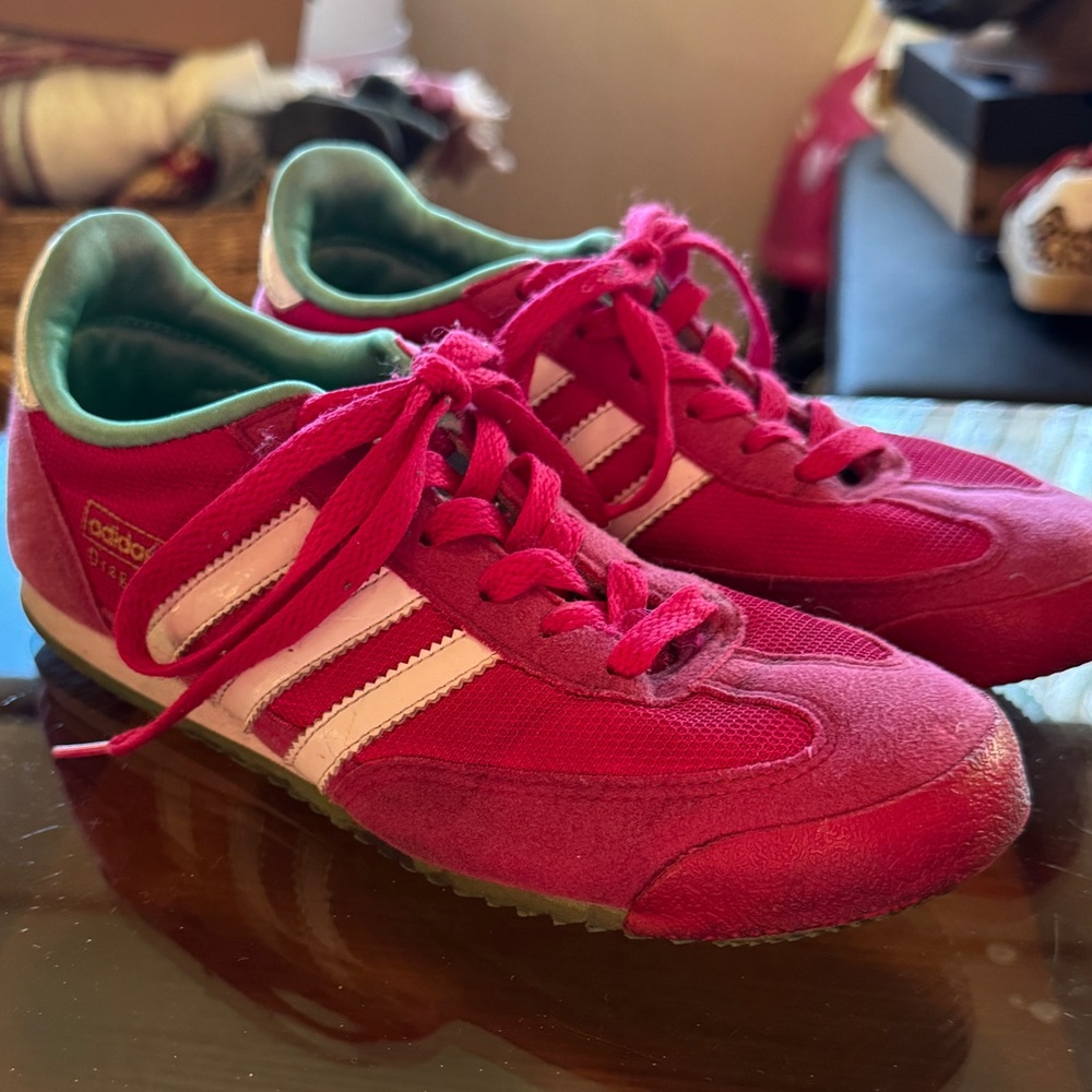 Hot pink and green Adidas dragon sneakers with white stripes